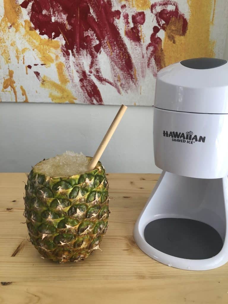Pour the juice over the shaved ice in the pineapple.